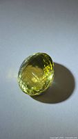 Front view of oval checkerboard-cut lemon citrine