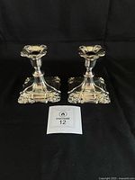 Front view of both candlesticks on black background