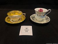 Yellow and blue Paragon teacup and saucer sets side by side