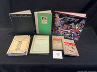 Group image showing all seven books front and back rows