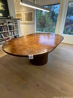 overall view of oval pedestal dining table in room