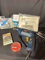 Group shot of drill and all accessories