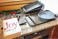 Group shot showing pans, sheets, cutters, rack, cookbook
