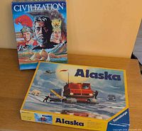 Front covers of both board game boxes