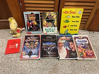 Group shot of all books, VHS tapes and plush