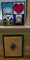 Both items: stained glass panel and framed painting
