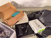 Group view of Twine adapter, Heider flashlight set, Track box, dive housing, and fabric pack