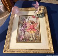 All three items: framed fairy print, pink marble ball on frame corner, small fairy figurine on frame
