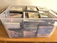 Full view of clear bin containing numerous CDs