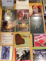 Overview of twelve CD fronts laid out on table