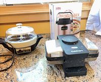Group shot of waffle maker, egg cooker, and boxed Thermos Shuttle Chef
