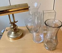 Lamp with group of vases on tabletop