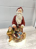 Front view showing Santa, elf and toy basket