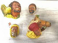 All four Bossons wall plaques on flat surface