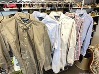 Rack view showing all five shirts