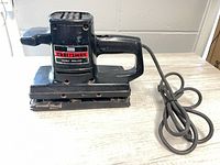 Left profile of Craftsman dual motion sander showing full tool and cord