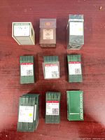 Eight Groz-Beckert needle packs and two other sealed packs on table