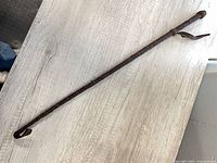 Full length view of leather braided riding crop