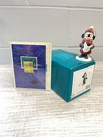 Ornament, box, and certificate arranged together