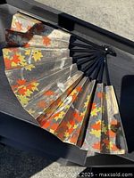 Fan fully opened showing maple leaf design