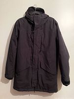 Front view of black O'Neill winter jacket hanging