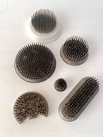 All six metal flower frogs grouped for overview