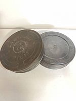 Pair of Kodak Eastman metal film canisters, top view