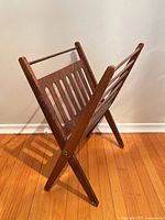 Full view of folded-out wooden magazine rack