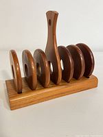 front left view showing six circular dividers and handle