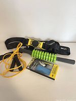 Group shot showing SKLZ strap, jump rope, roller stick, boxed stretch band