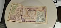 Obverse of Colombian 10 Pesos Oro note, serial 06954466 visible