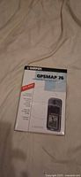 Front of Garmin GPSMAP 76 box showing product image and WAAS feature