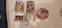 All five tins visible to identify Coca-Cola themed pieces