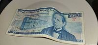 Obverse of 50-peso note showing Benito Juárez portrait, building, denomination, serial G0722953
