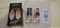 Box, two shot glasses, lot card