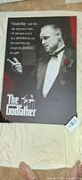 Full view of mounted Godfather poster on backing