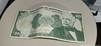Obverse of 20 bolívares note showing denomination, portrait and date