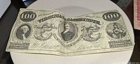 Full view of Virginia $100 treasury note front side showing design elements and wear