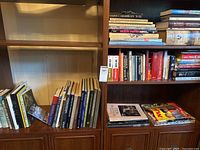 Overview of multiple shelves filled with books and magazines