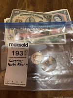 Bag containing banknotes and coins