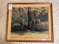 Full view of framed painting showing otters, mat, frame