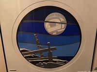 Front view of framed serigraph showing full artwork