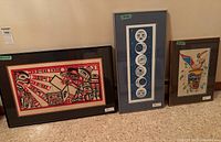 Three framed artworks including two serigraphs and smaller piece
