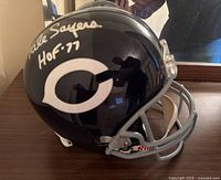 Left side of navy Chicago Bears helmet showing Gale Sayers signature and HOF-77 inscription