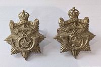 Front view of both Halifax Rifles cap badges