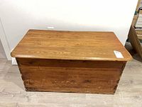 Top view of pine blanket box showing wood grain and lid condition