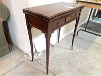 Full view front and side of wood fold-top card table