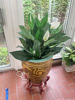 Planter on stand with faux plant, front view