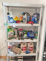 Full view of grey resin shelf with multiple maintenance items