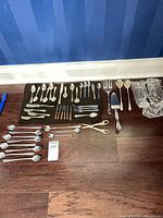 Full layout of flatware and escargot holders on floor